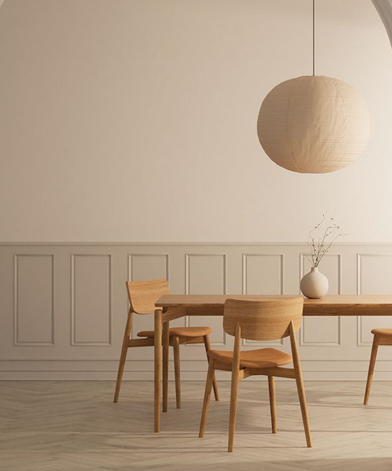 A collection of dining chairs with a leather seat around a wooden table