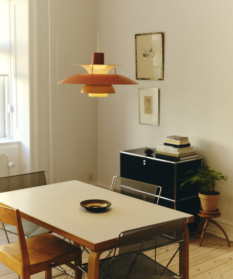 A PH 5 Pendant light above a dining room table