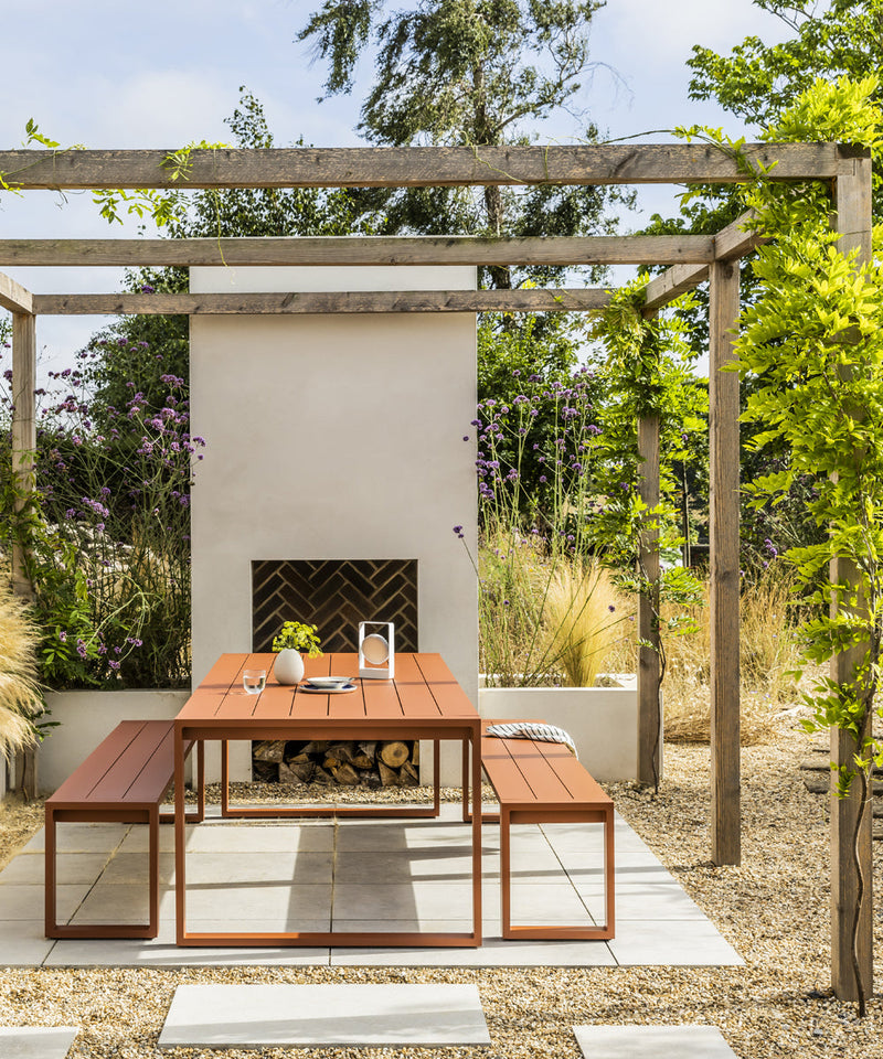 The Case Furniture Eos Picnic Collection  finished in rust under a pagoda