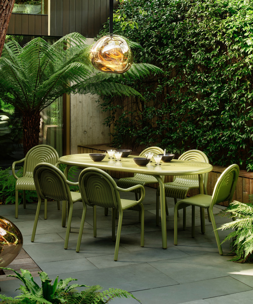 The contemporary Groove Collection by Tom Dixon in a very modern landscaped garden