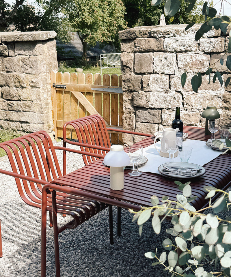 The Palissade Collection in a small courtyard garden finished in iron red