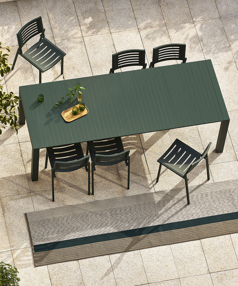 Birds eye view of the Mindo 111 extendable dining table in a dark green