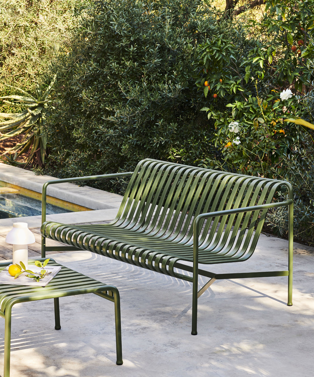A Palissade lounge bench next to a pool