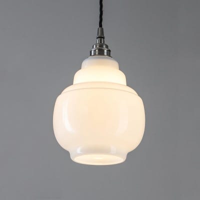 Barrel Opal pendant light, a testament to timeless charm and design excellence. This pendant light showcases an original and captivating shape, with a pristine opal glass shade that radiates a gentle, mesmerizing glow when illuminated.  A stylish addition